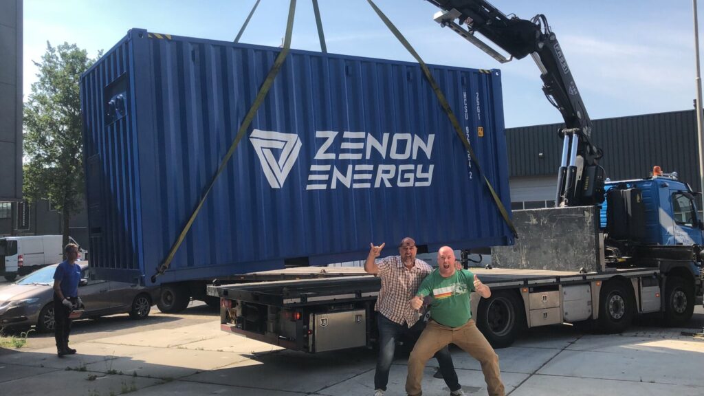 Johan & Christian standing in front of a container 
